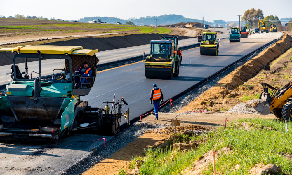 Road rollers building the new asphalt road